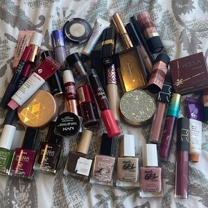 A lot of cosmetics: lipsticks, brow products, nail polishes